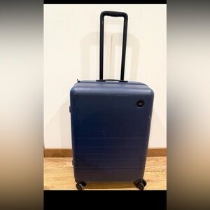 Monos Check In Luggage Suitcase Blue
